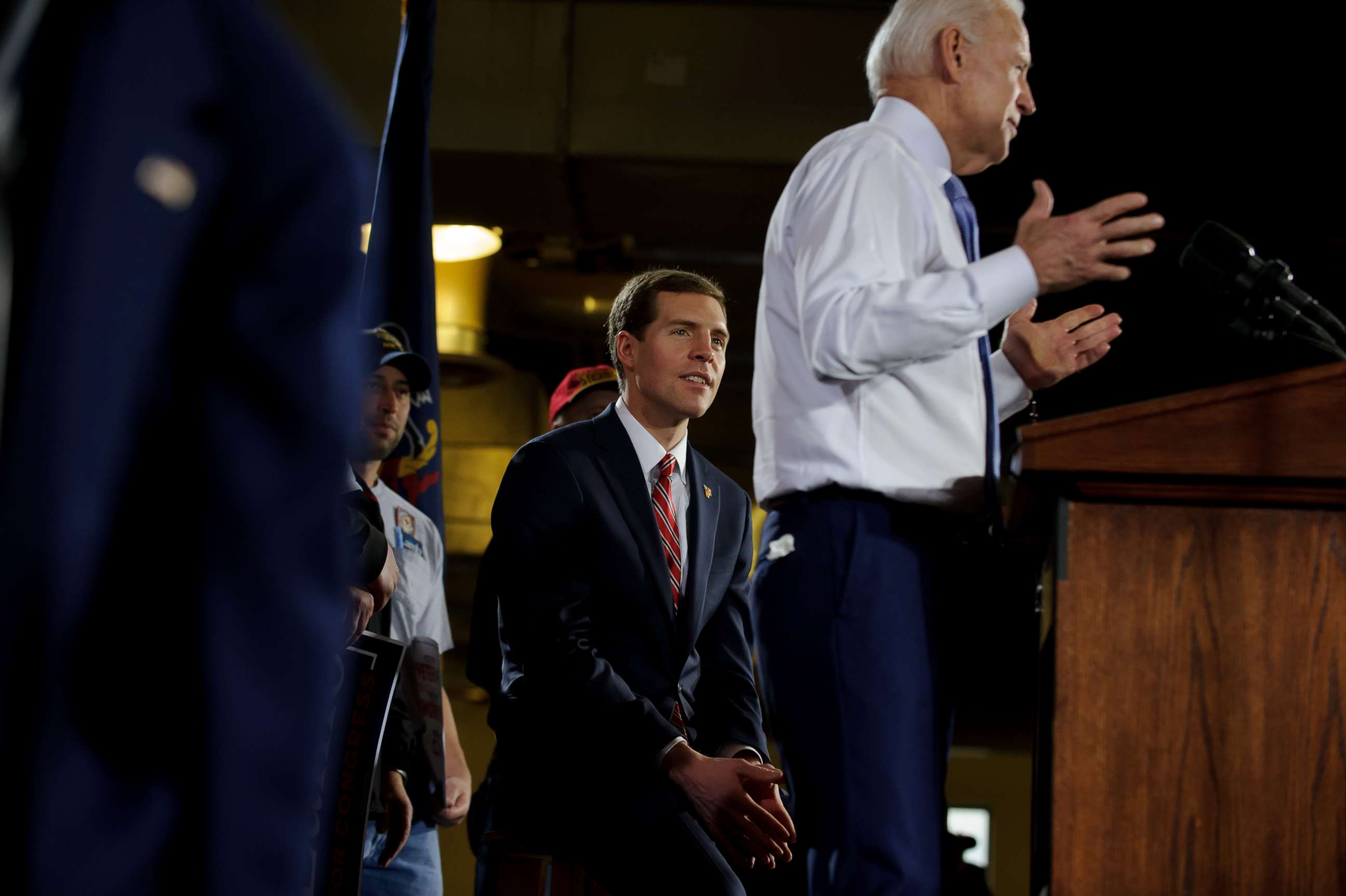 PHOTO: Democratic congressional candidate Conor Lamb listens as former Vice President Joe Biden speaks at a rally in support of, March 6, 2018, at the Union Carpenters Training Center in Pittsburgh, Penn. 