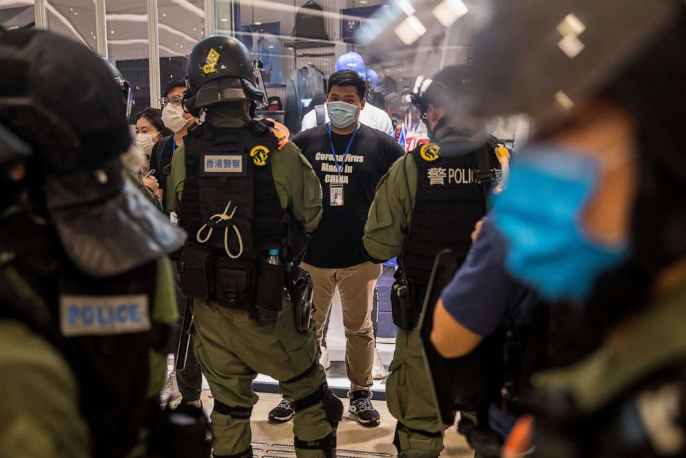PHOTO: Riot police stop and search a man  after pro-democracy protesters gathered in a shopping mall in Hong Kong, July 21, 2020.