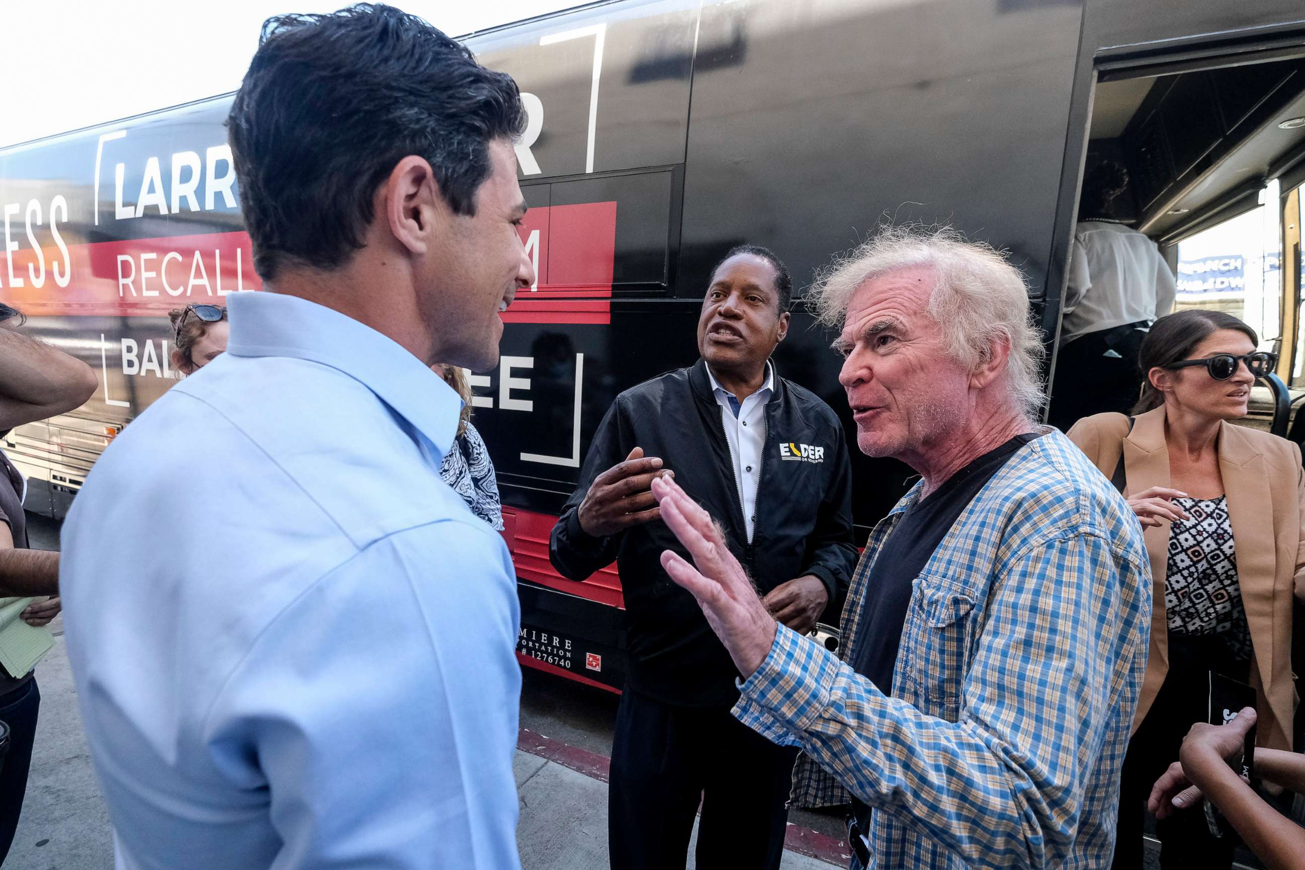 PHOTO: Republican conservative radio show host Larry Elder, center, argues with a TV reporter during an interview after visiting a deli during a campaign for the California gubernatorial recall election on Monday, Sept. 13, 2021, in Los Angeles.