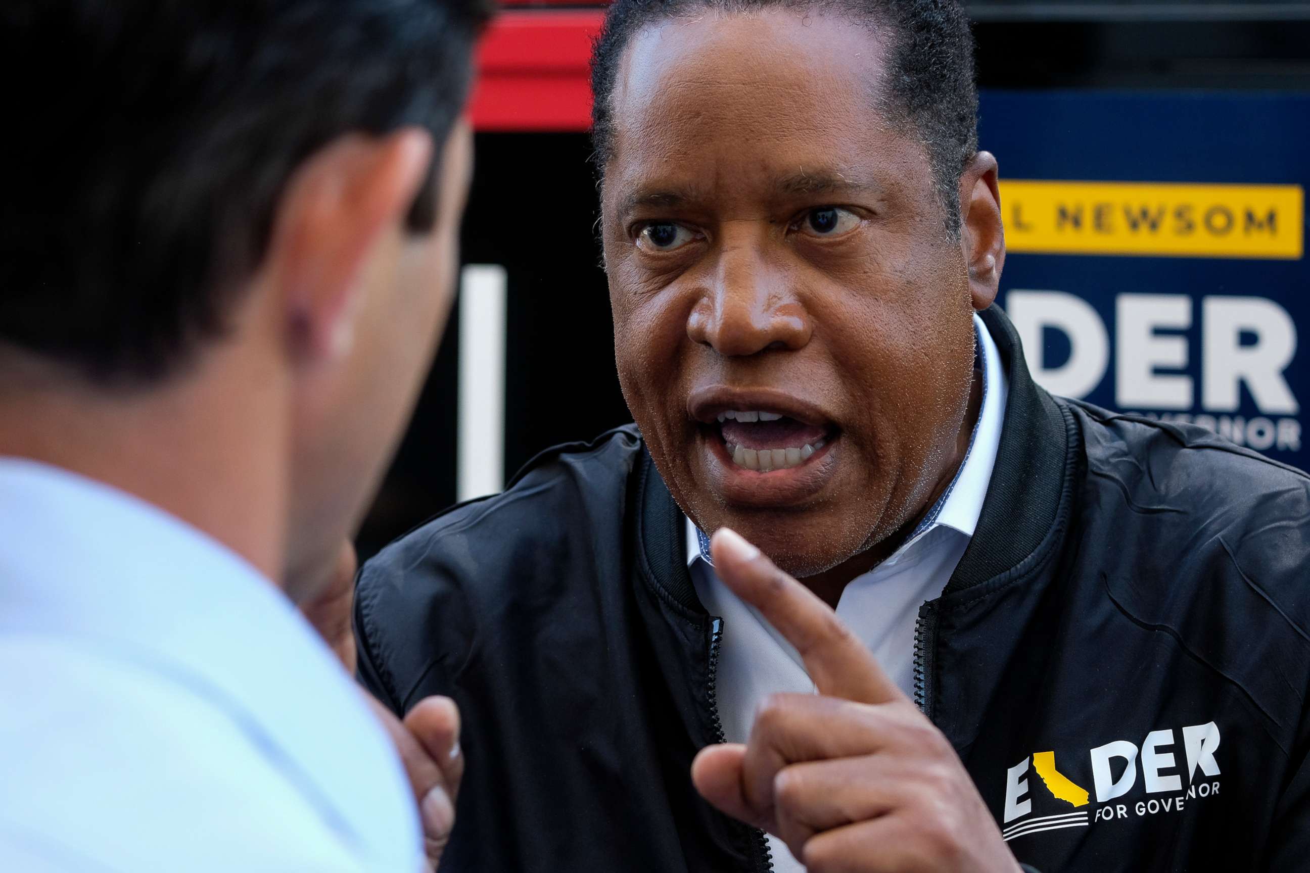 PHOTO: Republican conservative radio show host Larry Elder argues with a TV reporter during an interview after visiting a deli during a campaign for the California gubernatorial recall election on Monday, Sept. 13, 2021, in Los Angeles.