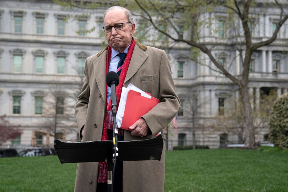 PHOTO: White House chief economic adviser Larry Kudlow talks with reporters about economic impacts of the coronavirus, outside the White House, March 24, 2020.