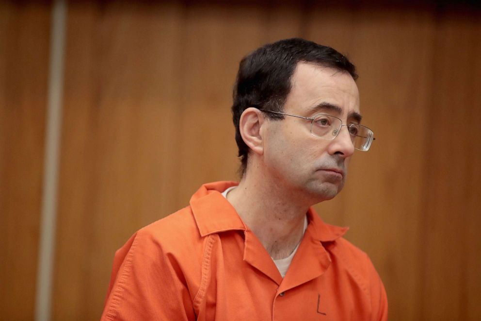 PHOTO: In this Feb. 5, 2018, file photo, Larry Nassar stands as he is sentenced by Judge Janice Cunningham for three counts of criminal sexual assault in Eaton County Circuit Court in Charlotte, Mich.