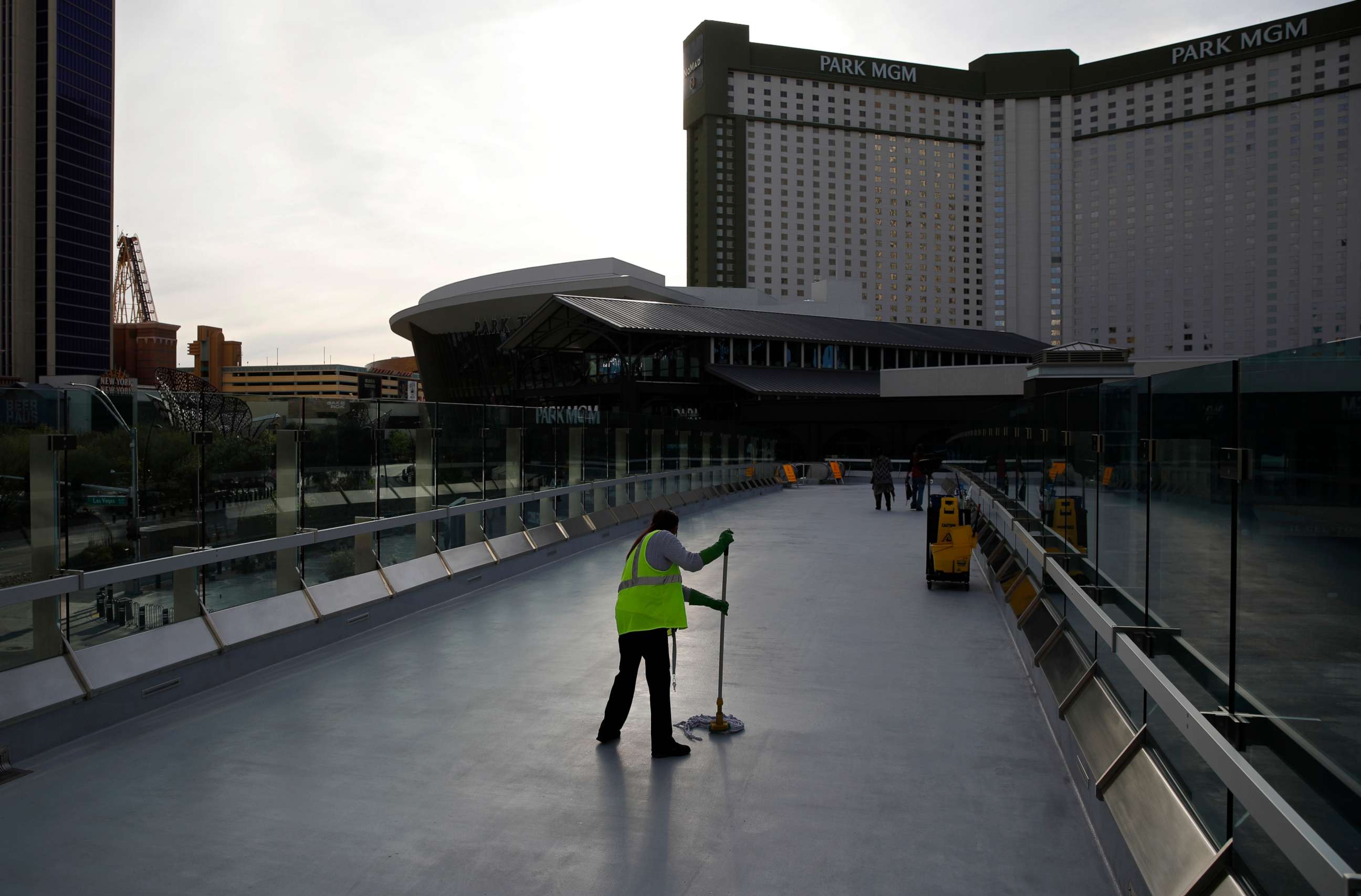 PHOTO: A worker cleans along the Las Vegas Strip devoid of the usual crowds as casinos and other business are shuttered due to the coronavirus outbreak in Las Vegas, March 31, 2020.