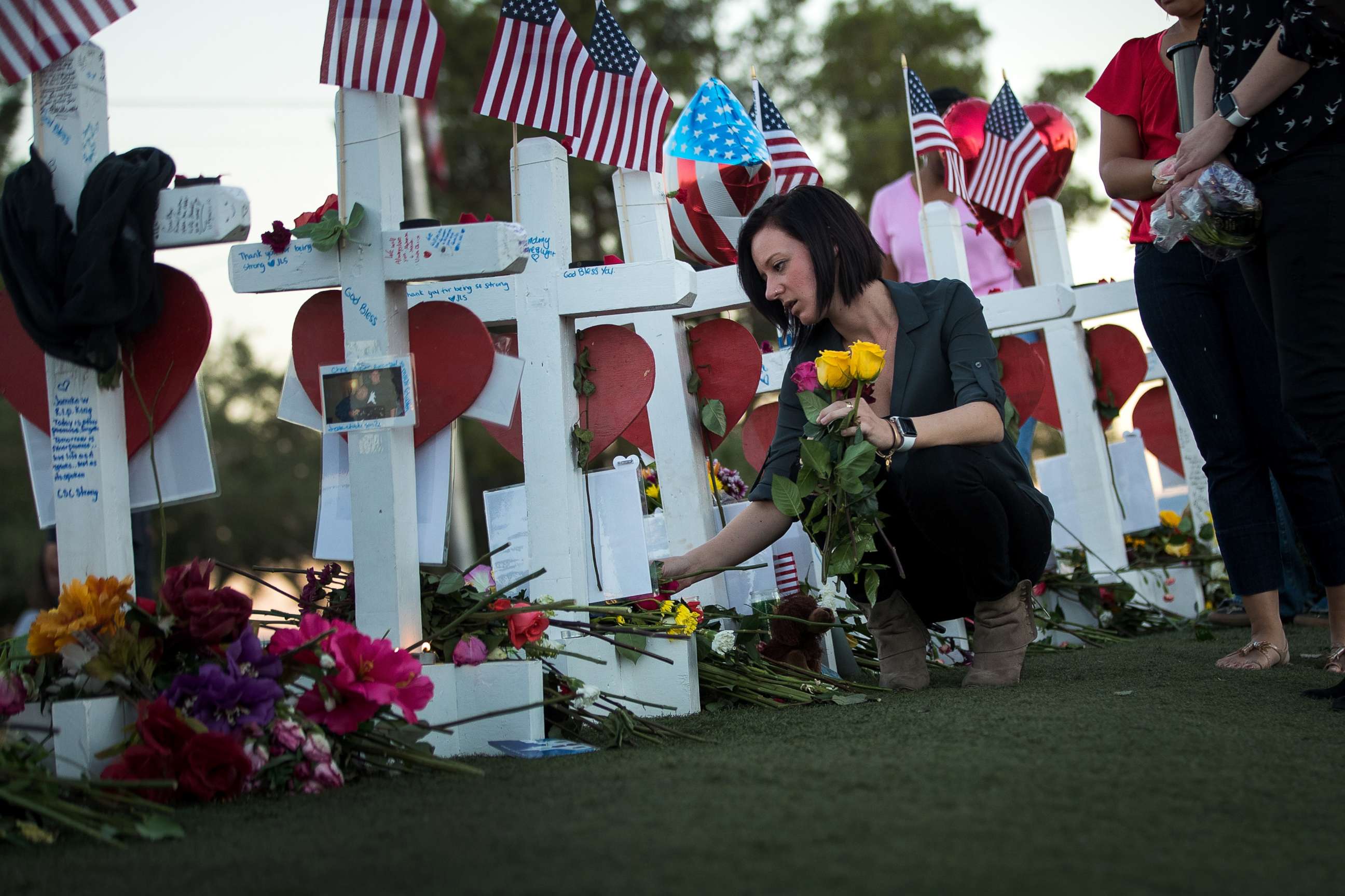 PHOTO: Antoinette Cannon, who worked as a trauma nurse and treated victims last Sunday night, leaves a rose at each of the 58 white crosses at a makeshift memorial on the south end of the Las Vegas Strip, Oct. 6, 2017 in Las Vegas, Nevada.
