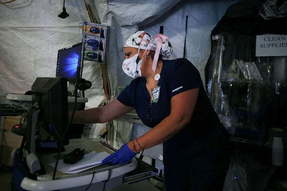 PHOTO: A nurse works in a triage center for patients suspected of being COVID-19 positive outside El Centro Regional Medical Center in hard-hit Imperial County, Calif., July 21, 2020.