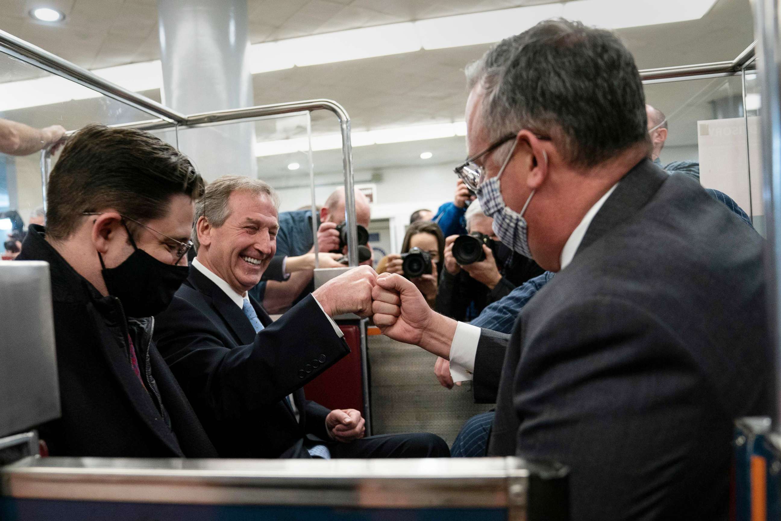 PHOTO: Trump lawyer Michael van der Veen, second from left, celebrates after the second impeachment trial of former President Donald Trump, Feb, 13, 2021, in Washington, D.C. Trump was acquitted of inciting the deadly January 6 attack on the U.S. Capitol.