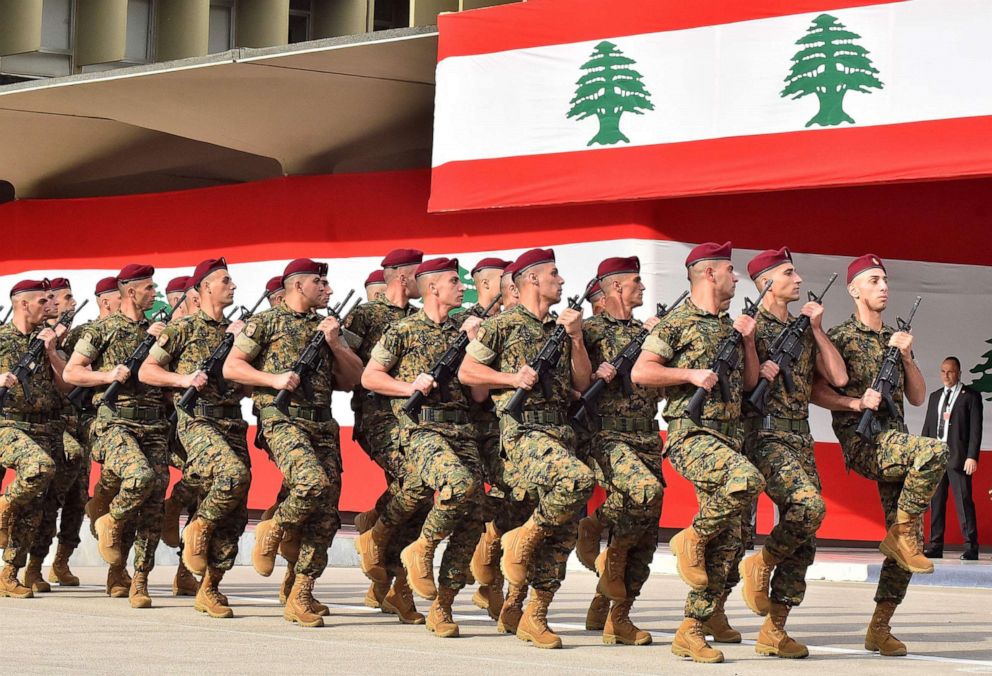 PHOTO: Lebanese army soldiers march during a military parade commemorating the 76th anniversary of Lebanese independence from France at the Defence Ministry headquarters in Yarze on Nov. 22, 2019.
