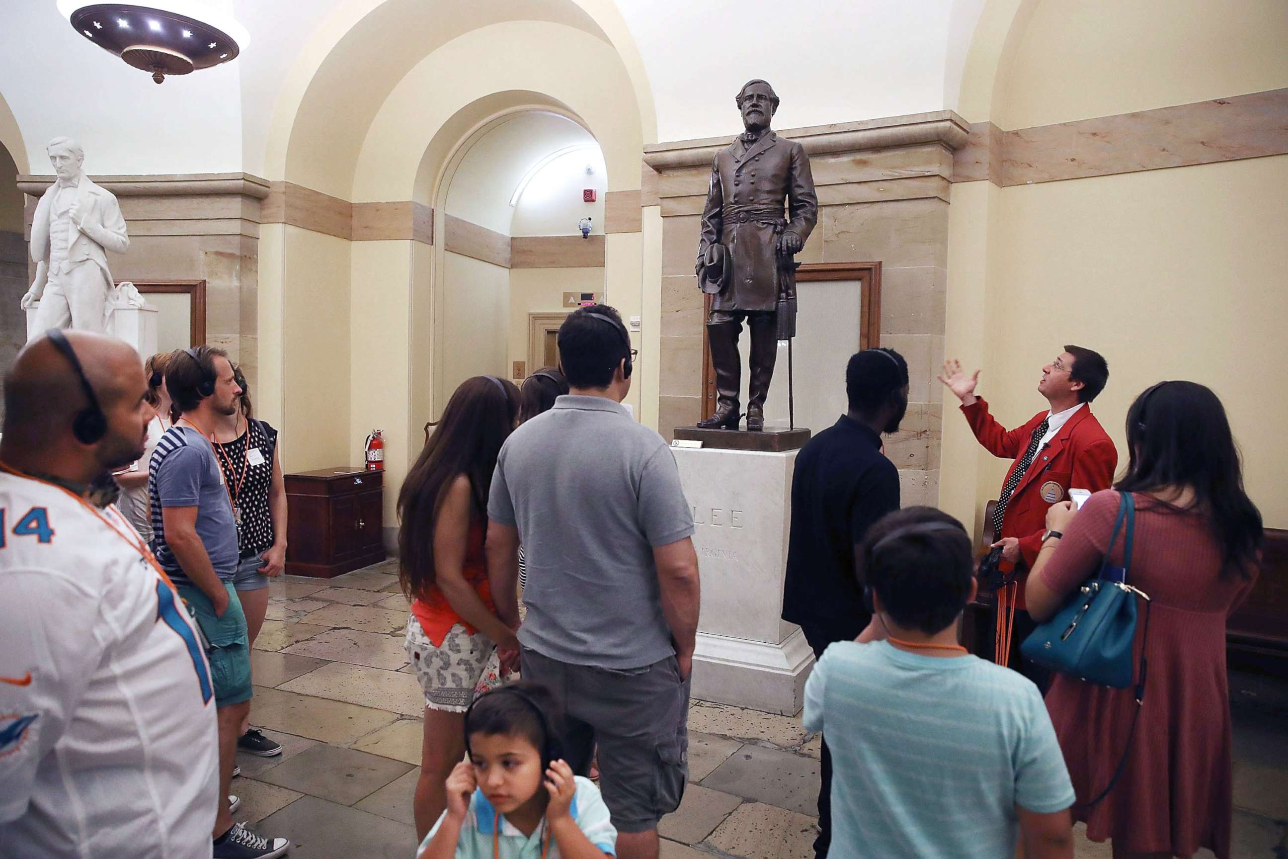 PHOTO: A tour guide talks about the Statue of Confederate General Robert E. Lee that is located inside the Capitol, Aug.17, 2017, in Washington, DC. 