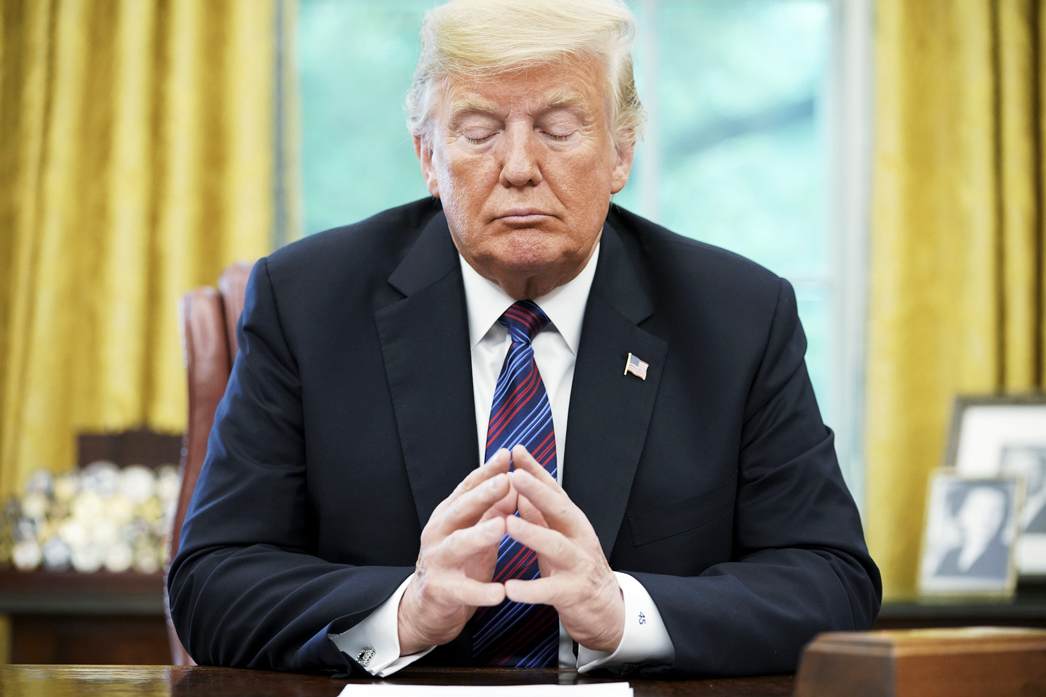 PHOTO: President Donald Trump listens during a phone conversation in the Oval Office of the White House in Washington, Aug. 27. 2018