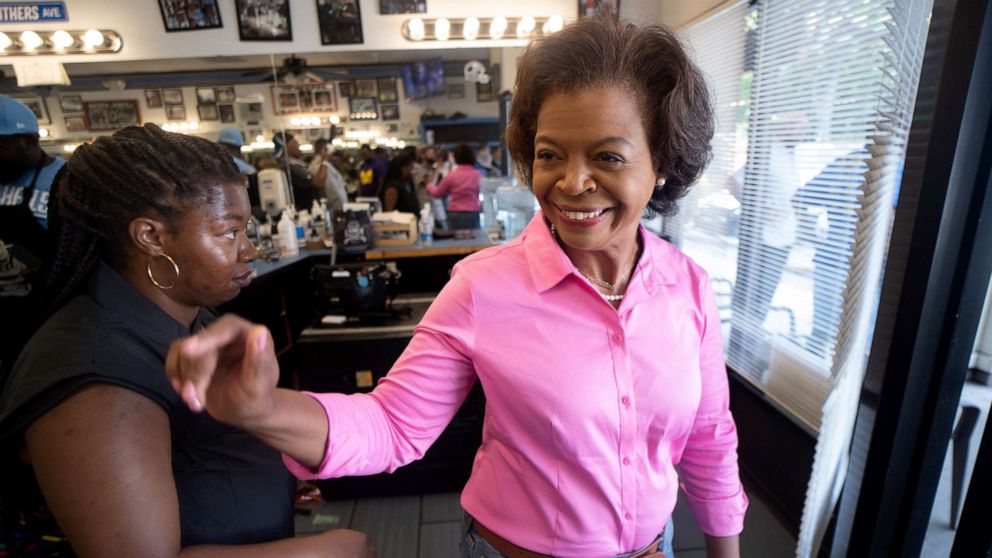 PHOTO: Democratic Senate Candidate Cheri Beasley exits Fourth Ward Barber & Hairstyle after speaking with potential voters in Charlotte, N.C., Sept. 17, 2022.