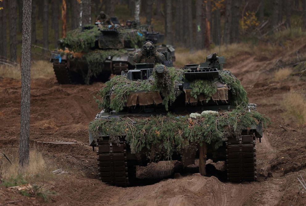 PHOTO: Two Leopard 2A6 main battle tanks participate in the NATO Iron Wolf military exercises, Oct. 27, 2022, in Pabrade, Lithuania.