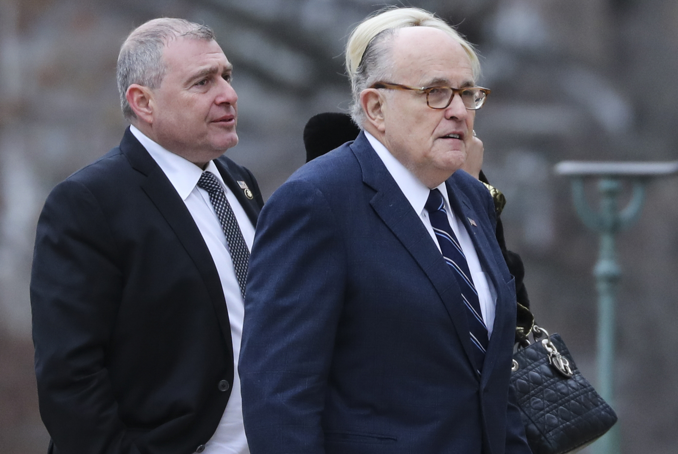 PHOTO: Rudy Giuliani, right, and Soviet born businessman who served as Giuliani's fixer in Ukraine, Lev Parnas, left, arrive for the funeral of former president George H.W. Bush at the National Cathedral in Washington on Dec. 5, 2018.