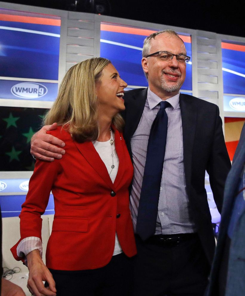 PHOTO: Levi Sanders, right, shares a laugh with Maura Sullivan following a debate for Democratic hopefuls in New Hampshire's 1st Congressional District at the Institute of Politics at St. Anselm College in Manchester, N.H., Sept. 5, 2018. 