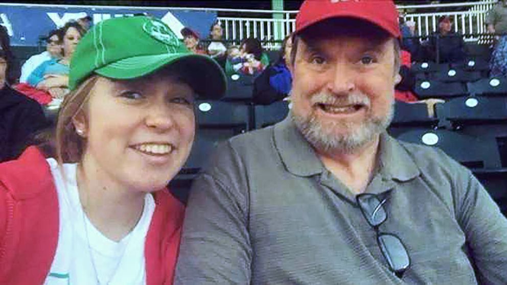 PHOTO: Lexi Jackson and her father, Joel Jackson, take a photo at a baseball game in her senior year of high school in an undated handout photo.