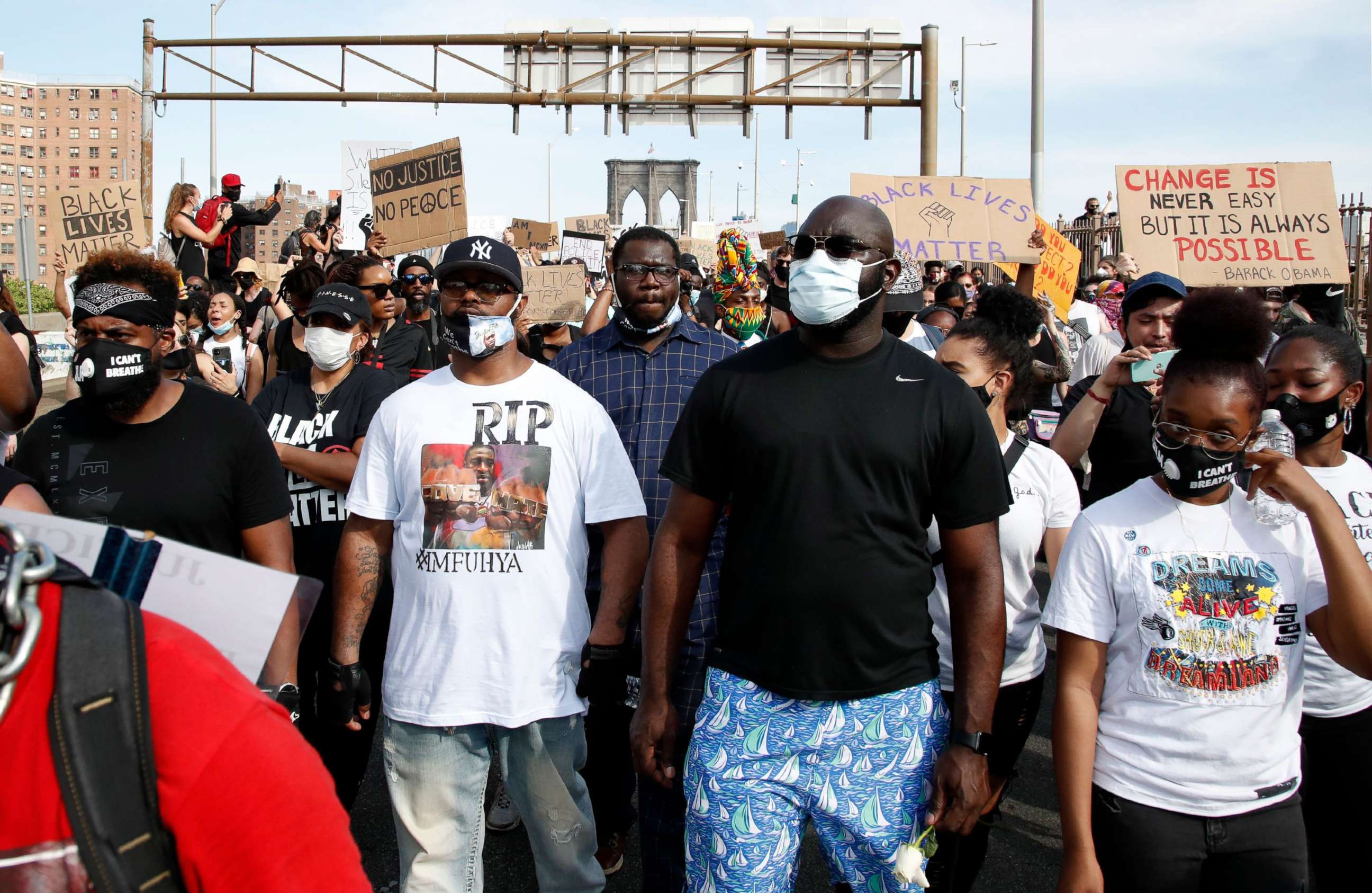 PHOTO: George Floyd's brother Terrence, second from left, walks across the the Manhattan side of the Brooklyn Bridge after a George Floyd Memorial demonstration at Cadman Plaza in Brooklyn, New York, June 4, 2020.