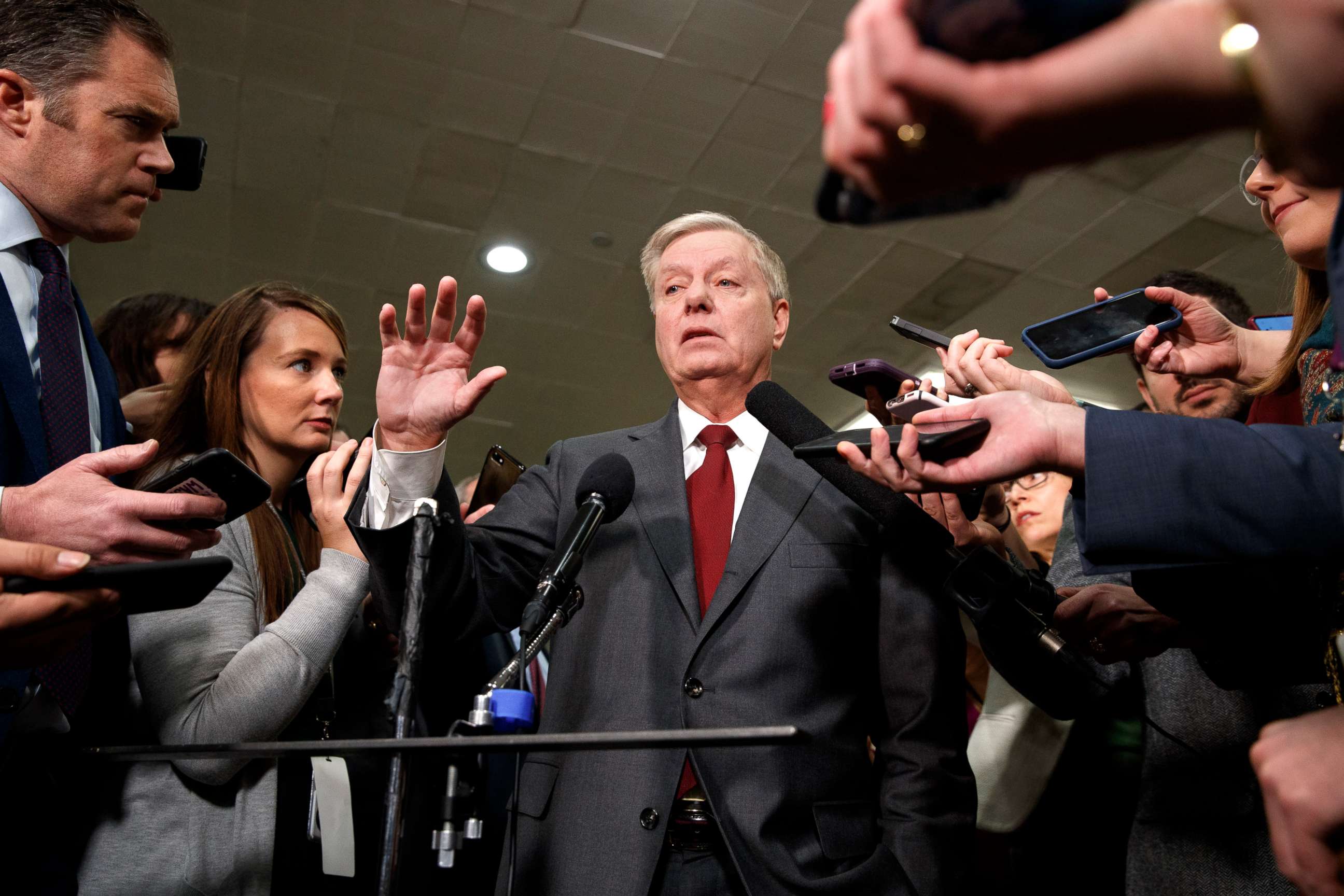 PHOTO: Sen. Lindsey Graham speaks to the media before attending the impeachment trial of President Donald Trump on charges of abuse of power and obstruction of Congress, Jan. 23, 2020, on Capitol Hill in Washington.