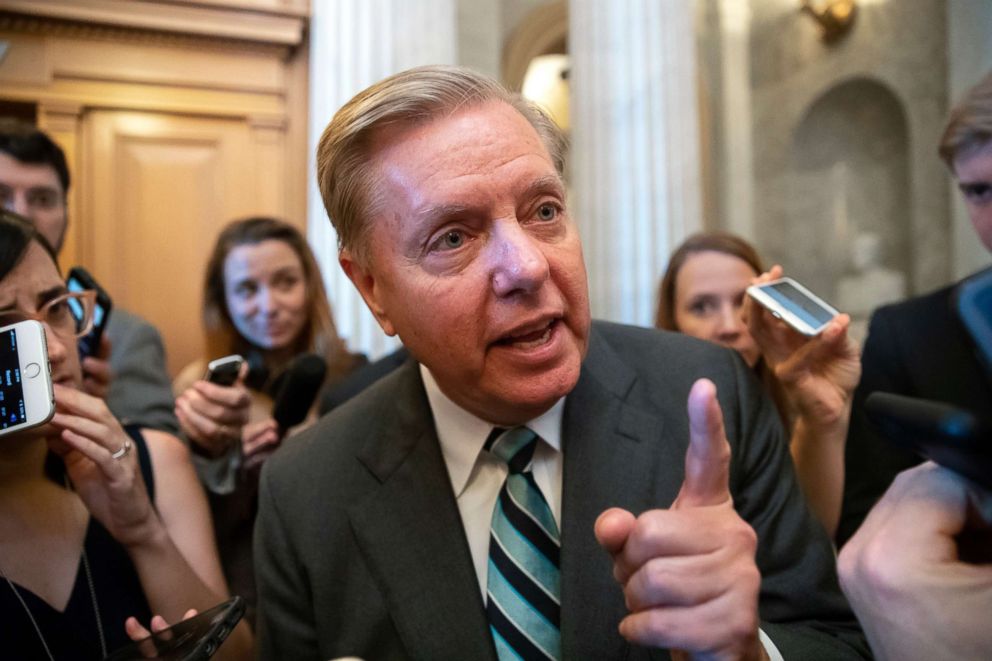 PHOTO: Sen. Lindsey Graham, a member of the Senate Judiciary Committee, makes a point to reporters about Brett Kavanaughs accusers as he arrives for a vote at the Capitol in Washington, Sept. 26, 2018.