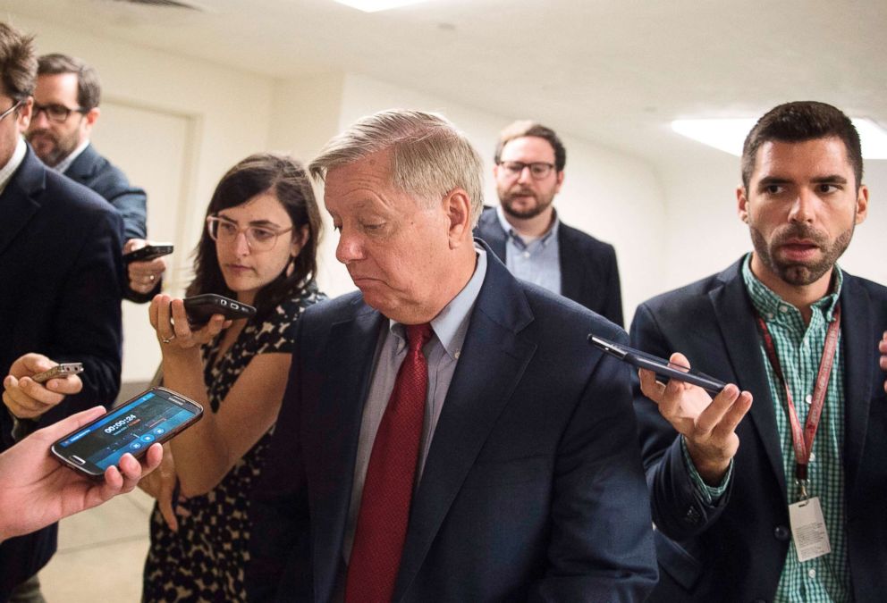 PHOTO: Senator Lindsey Graham is surrounded by reporters on July 17, 2018, on Capitol Hill in Washington, D.C.