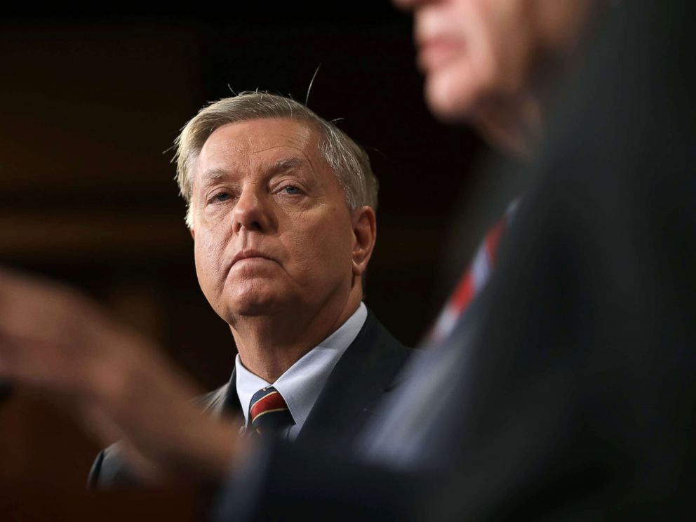 PHOTO: Sen. Lindsey Graham listens as Sen. Robert Menendez speaks during a press conference at the U.S. Capitol, Dec. 20, 2018. Graham, Menendez and Sen. Jack Reed spoke out against President Trumps decision to remove U.S. military forces from Syria.