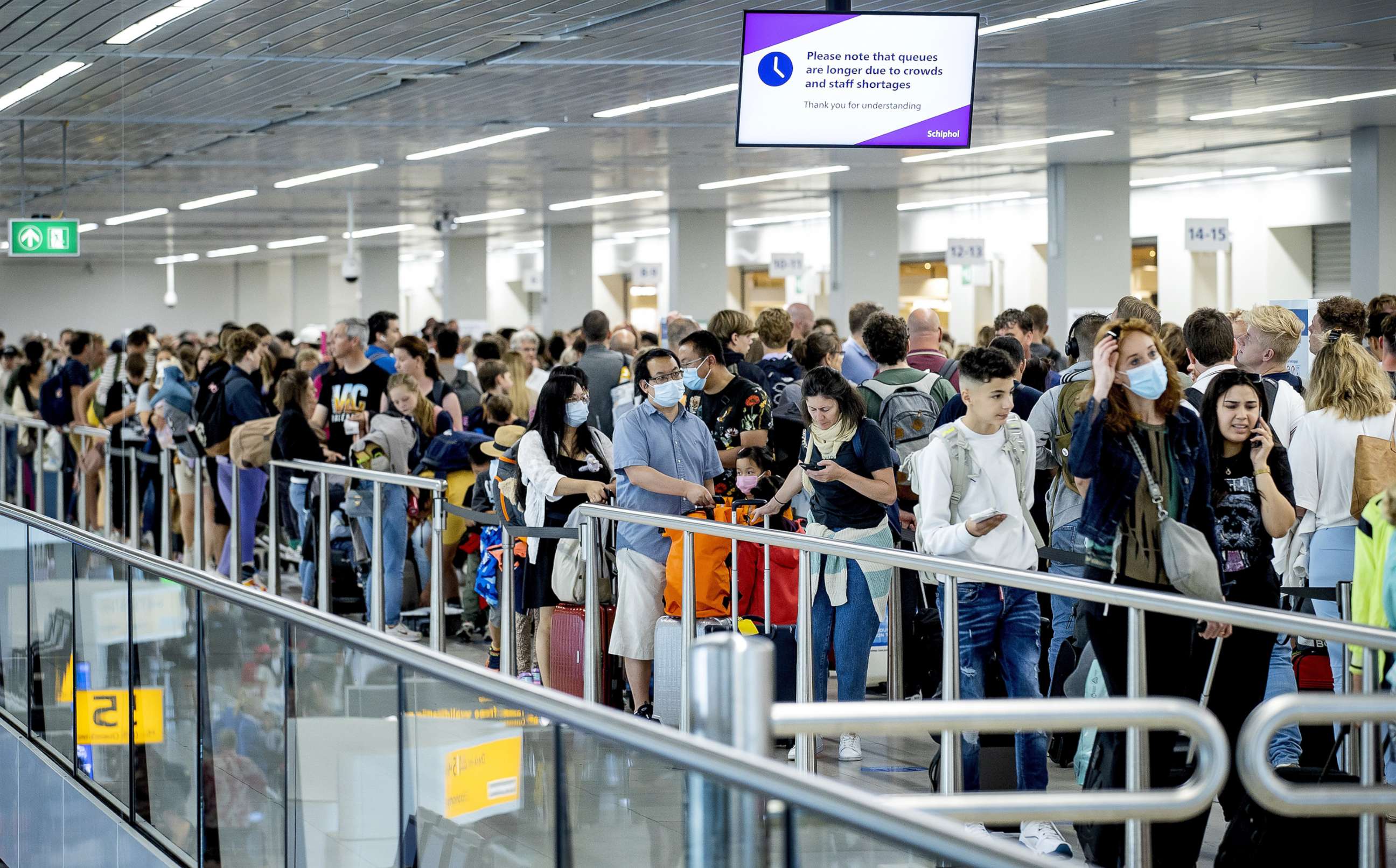 PHOTO: Travelers line up at the airport in Schiphol, Netherlands, on July 9, 2022.