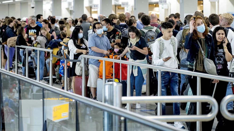 PHOTO: Travelers line up at the airport in Schiphol, Netherlands, on July 9, 2022.