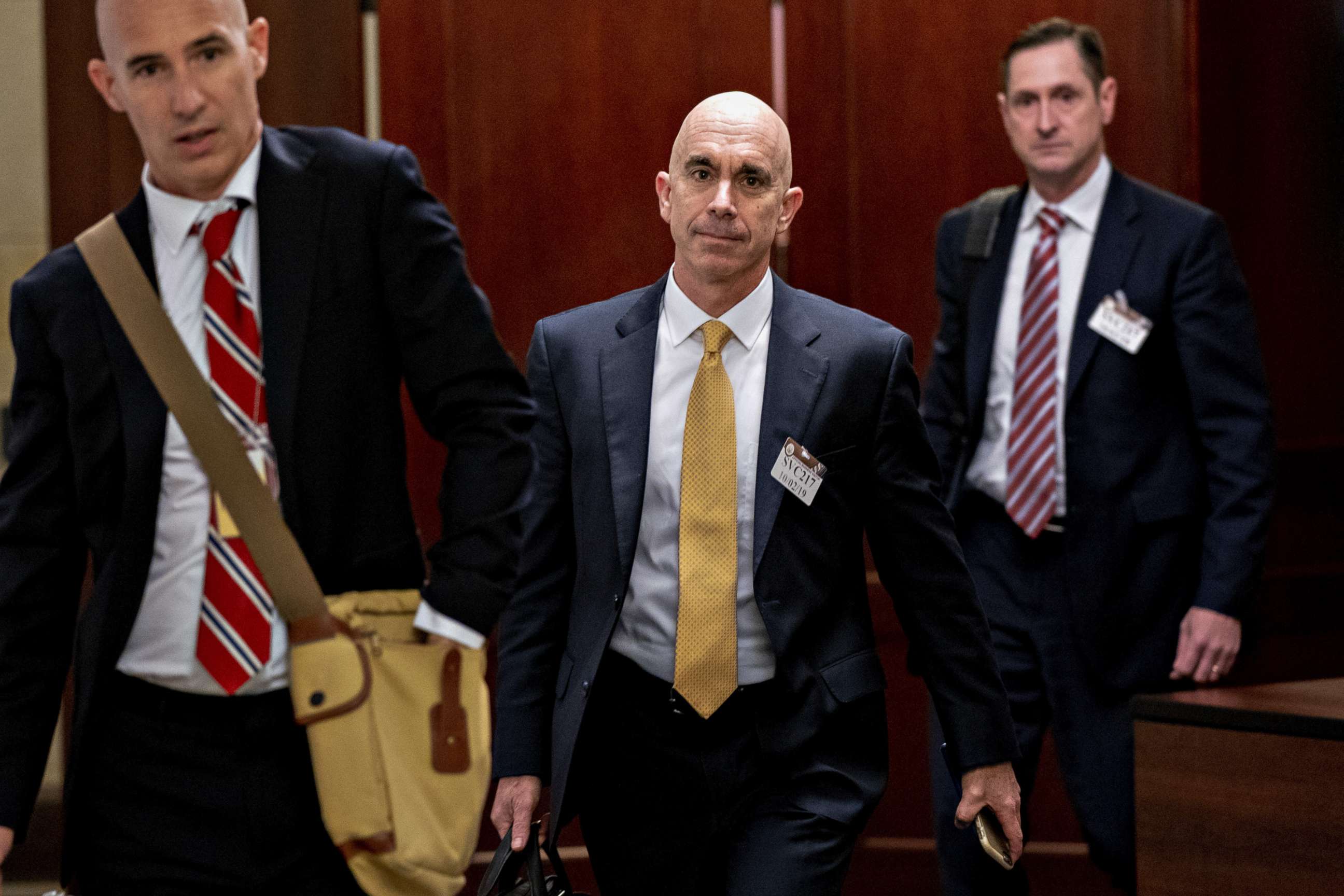 PHOTO: Steve Linick, State Department inspector general, center, exits after closed-door testimony on Capitol Hill in Washington, D.C., U.S., on Wednesday, Oct. 2, 2019.