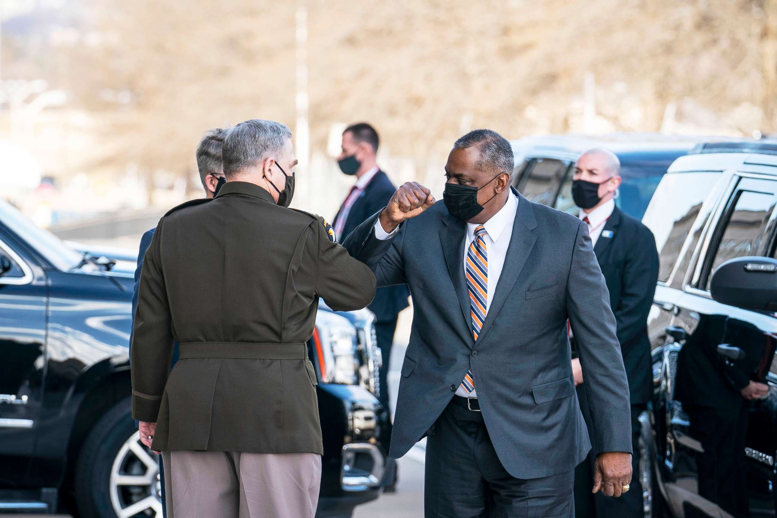 PHOTO: Mark Milley, Chairman of the Joint Chiefs of Staff, greets incoming Secretary of Defense Lloyd Austin outside of the Pentagon on Austin's first day in his new role, in Arlington, Va., Jan. 22, 2021. 