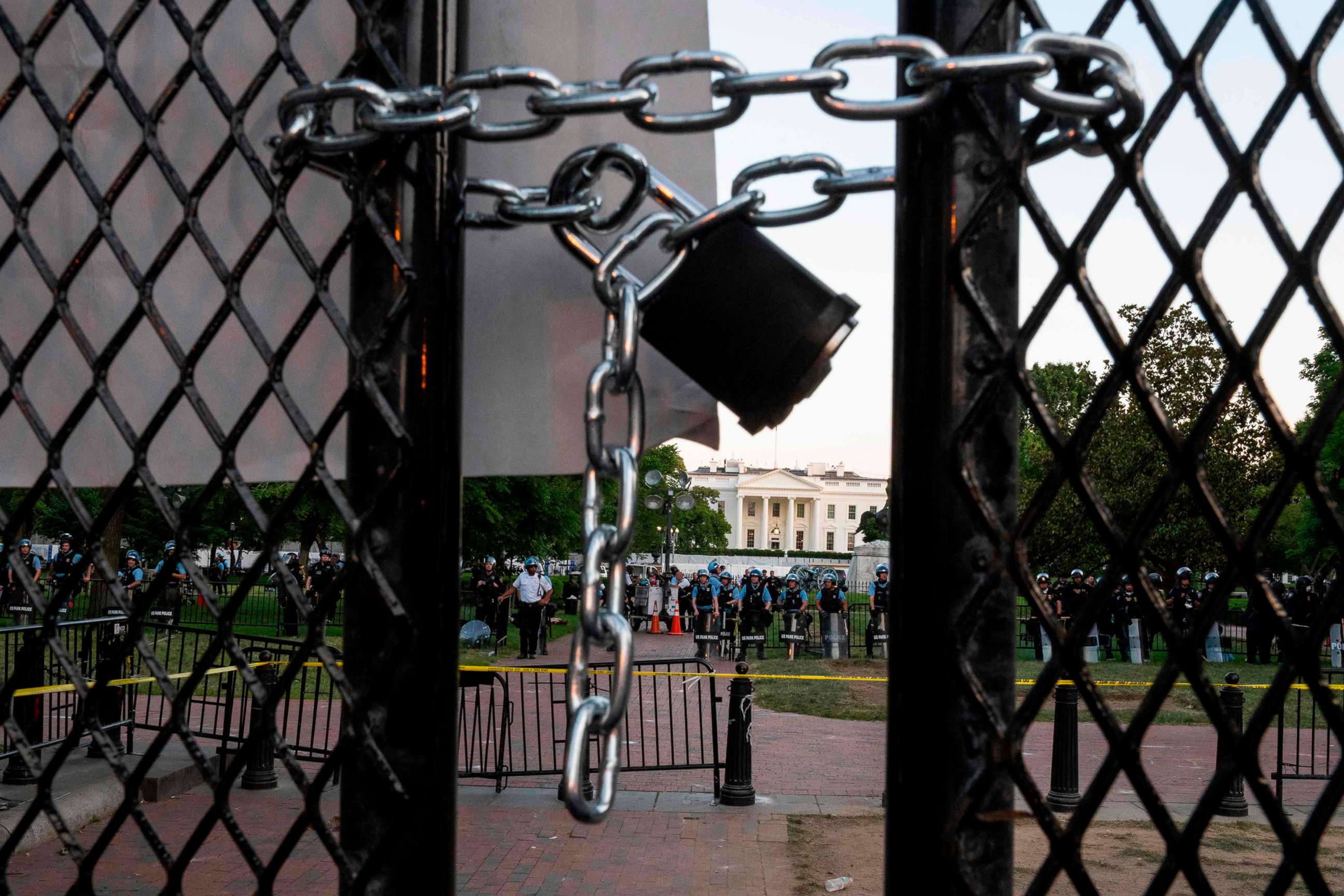 PHOTO: A locked padlock keeps a metal fence recently erected in front of the White House and meant to keep protestors at bay closed on June 2, 2020.
