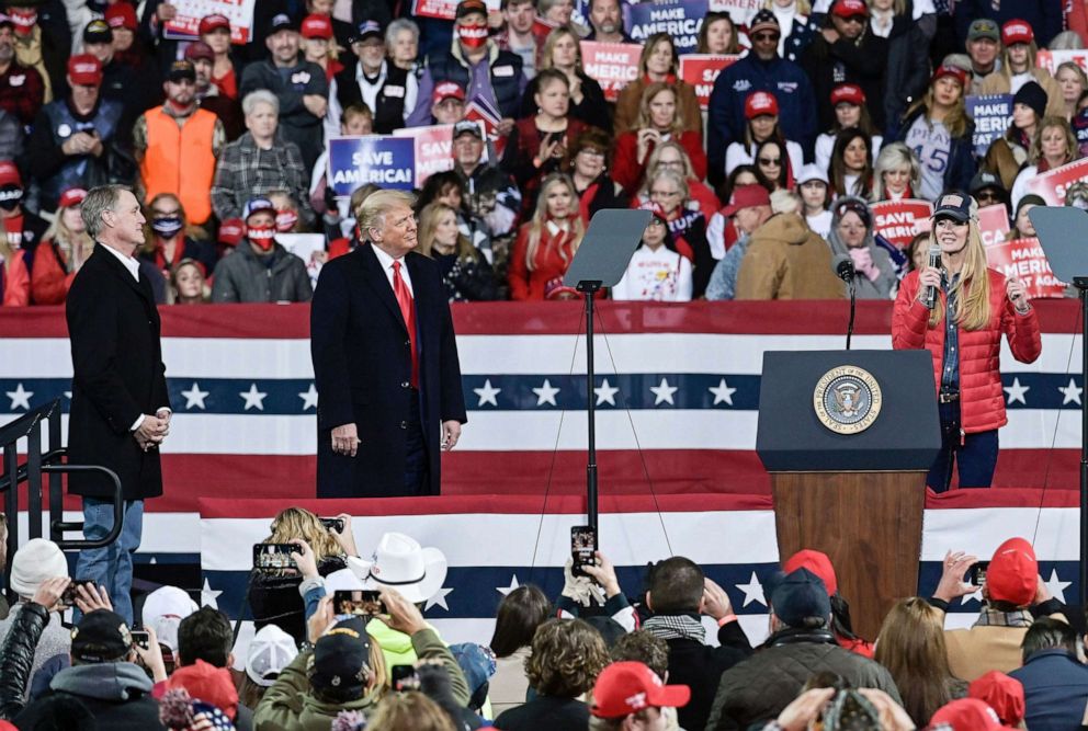 PHOTO: Georgia Republican Senator David Perdue, President Donald Trump and Georgia Republican Senator Kelly Loeffler speak during a campaign rally at Valdosta Regional Airport in Valdosta, Ga, Dec. 5, 2020.