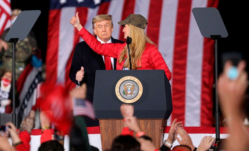 President Donald Trump gives a thumbs up as Republican Sen. Kelly Loeffler speaks during a rally in Dalton, Georgia, on Jan. 4, 2021.