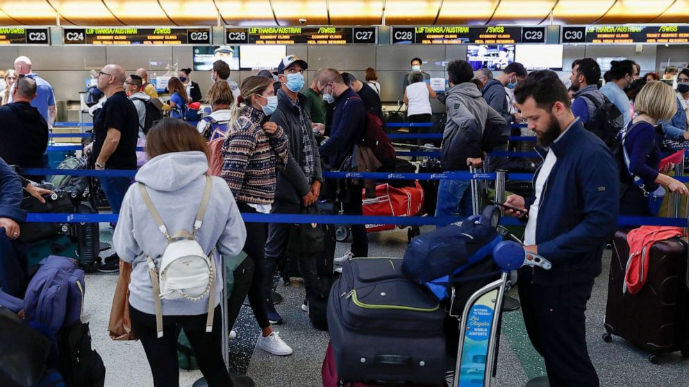 PHOTO: In this May 27, 2022, file photo, travelers wait in check-in lines at Tom Bradley International Terminal at Los Angeles International Airport in Los Angeles.