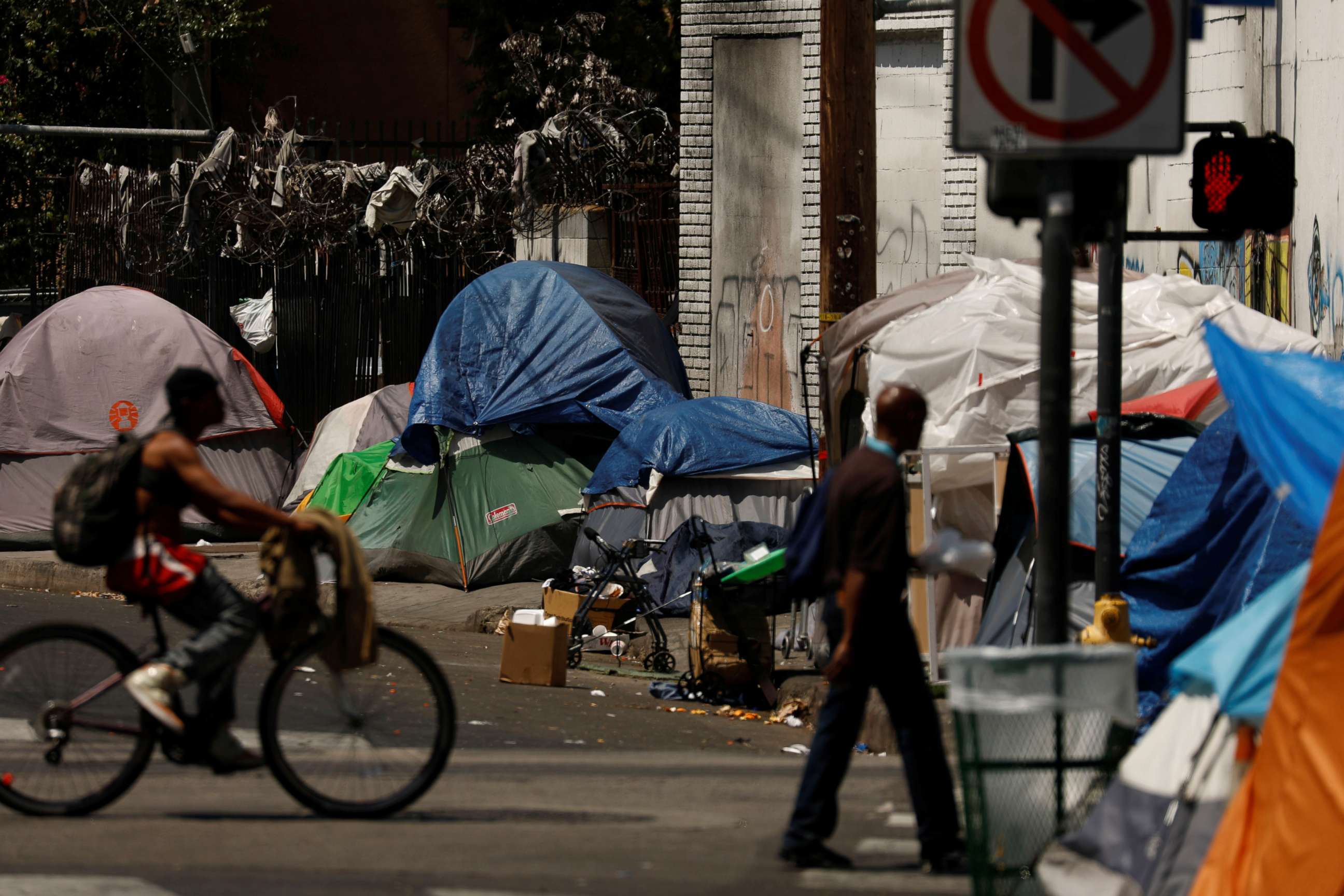 PHOTO: Tents and tarps erected by homeless people are shown along sidewalks and streets in the skid row area of downtown Los Angeles, June 28, 2019.