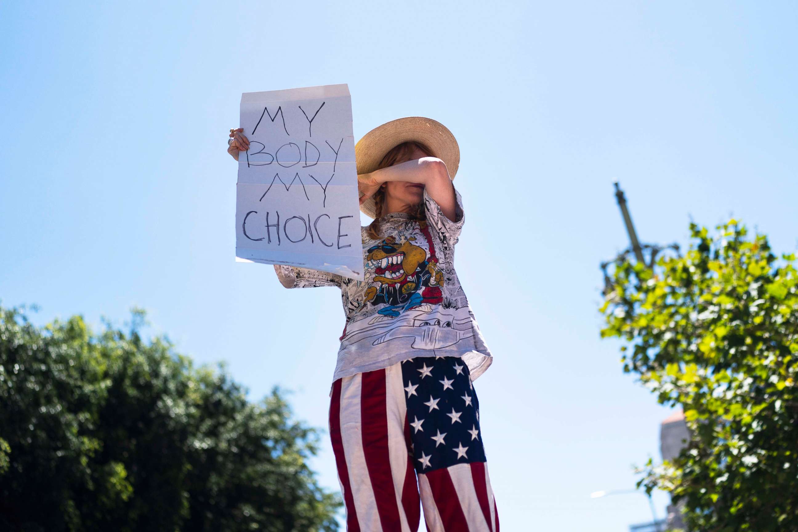 PHOTO: Abortion-rights advocate Eleanor Wells, 34, wipes her tears during a protest in Los Angeles, on June 24, 2022.