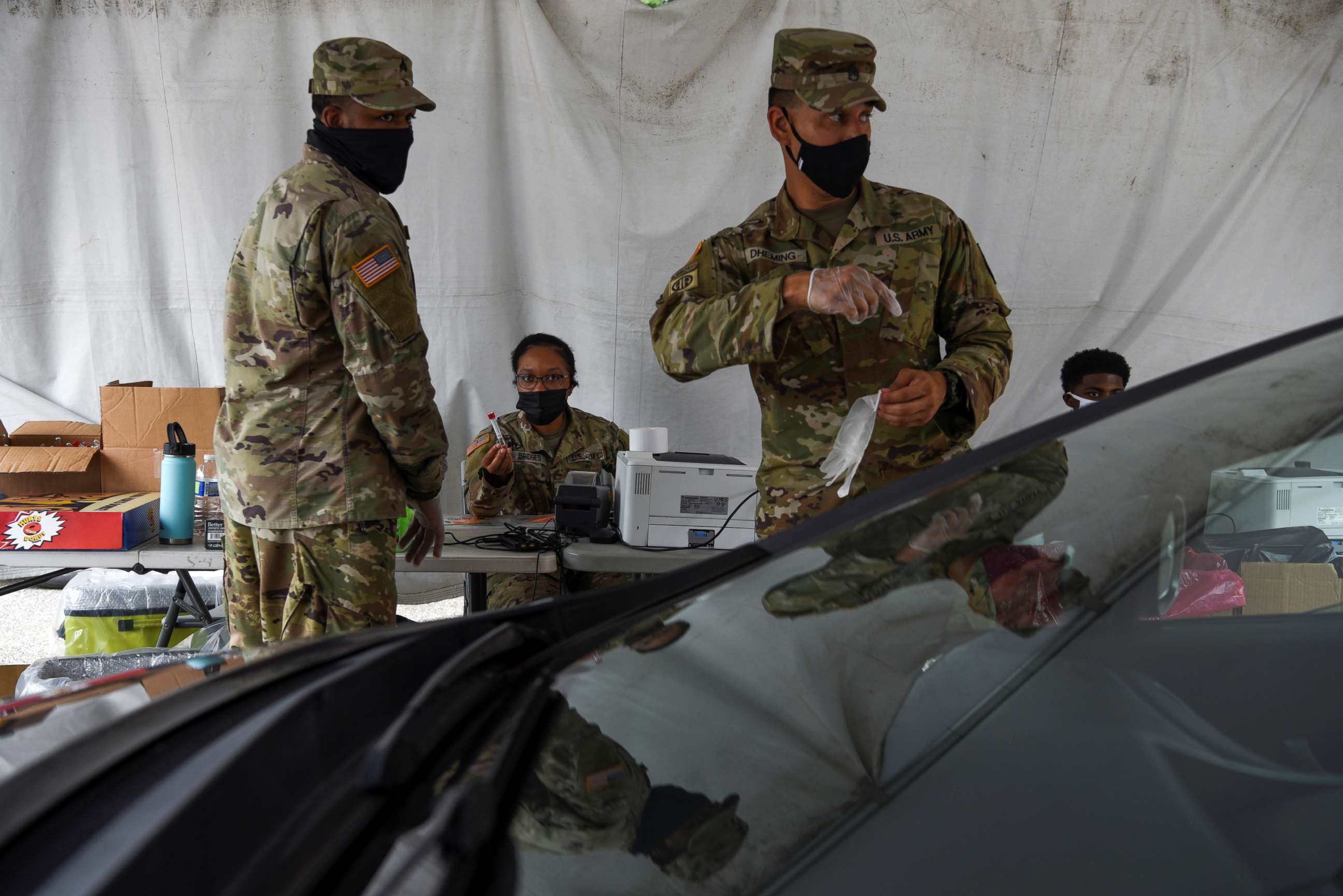PHOTO: Members of the U.S. Army operate a drive-thru testing site as cases of the coronavirus disease surge across the state, in New Orleans, Aug. 6, 2021.