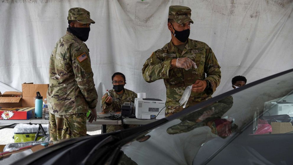 PHOTO: Members of the U.S. Army operate a drive-thru testing site as cases of the coronavirus disease surge across the state, in New Orleans, Aug. 6, 2021.