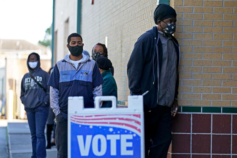 PHOTO: In this Nov. 3, 2020, people line up to vote on Election Day at the Martin Luther King, Jr. Elementary School, in the Lower Ninth Ward in New Orleans.