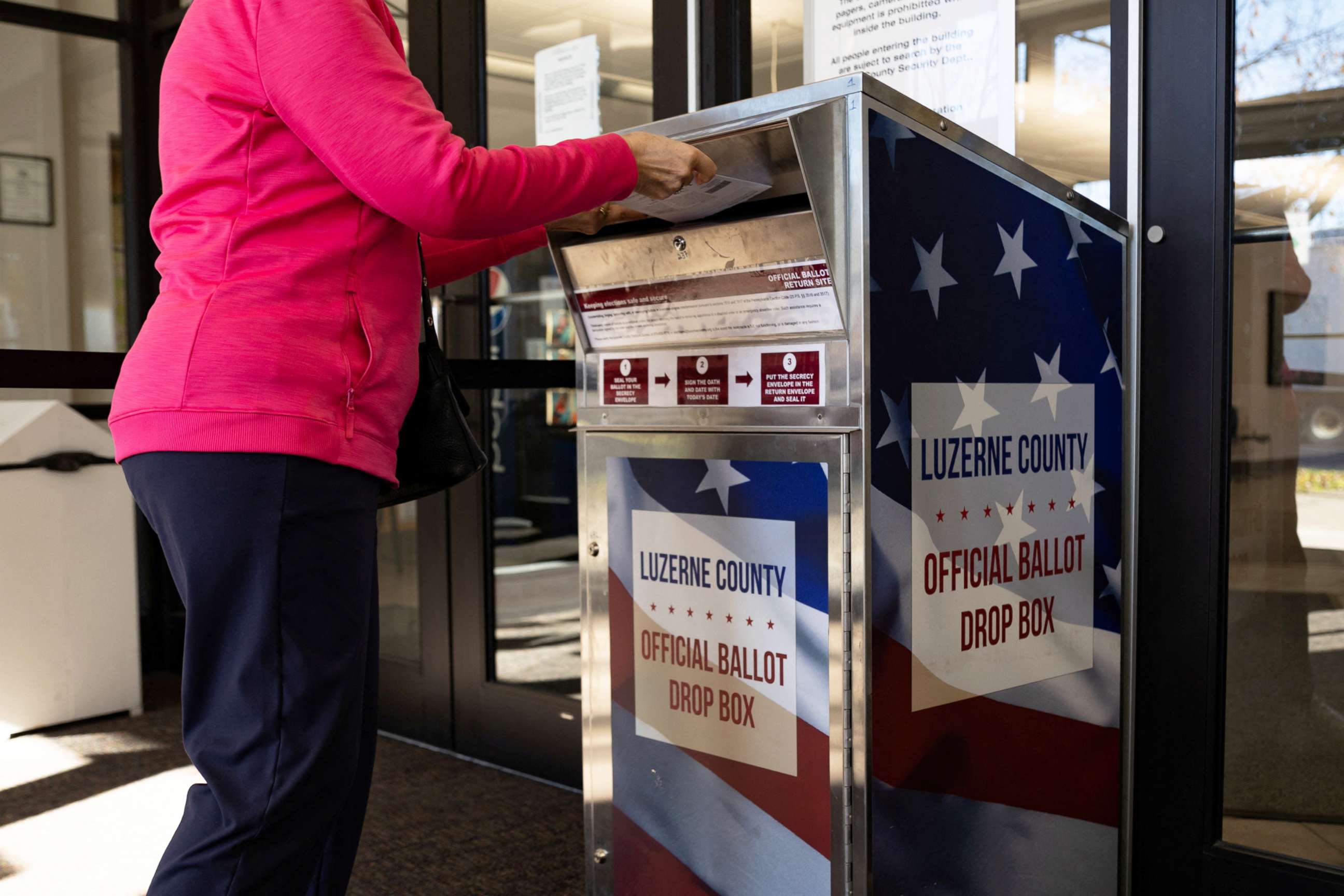 PHOTO: In this Nov. 3, 2022, file photo, a Luzerne County resident drops off a mail-in ballot in Wilkes-Barre, Penn.