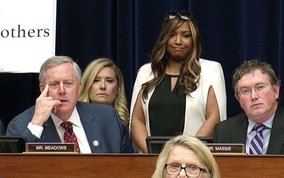 PHOTO: In this image made from a Feb. 27, 2019, video, Lynne Patton who works in the Trump administration at the Department of Housing and Urban Development, stands behind Rep. Mark Meadows as Michael Cohen  testifies on Capitol Hill in Washington, D.C. 