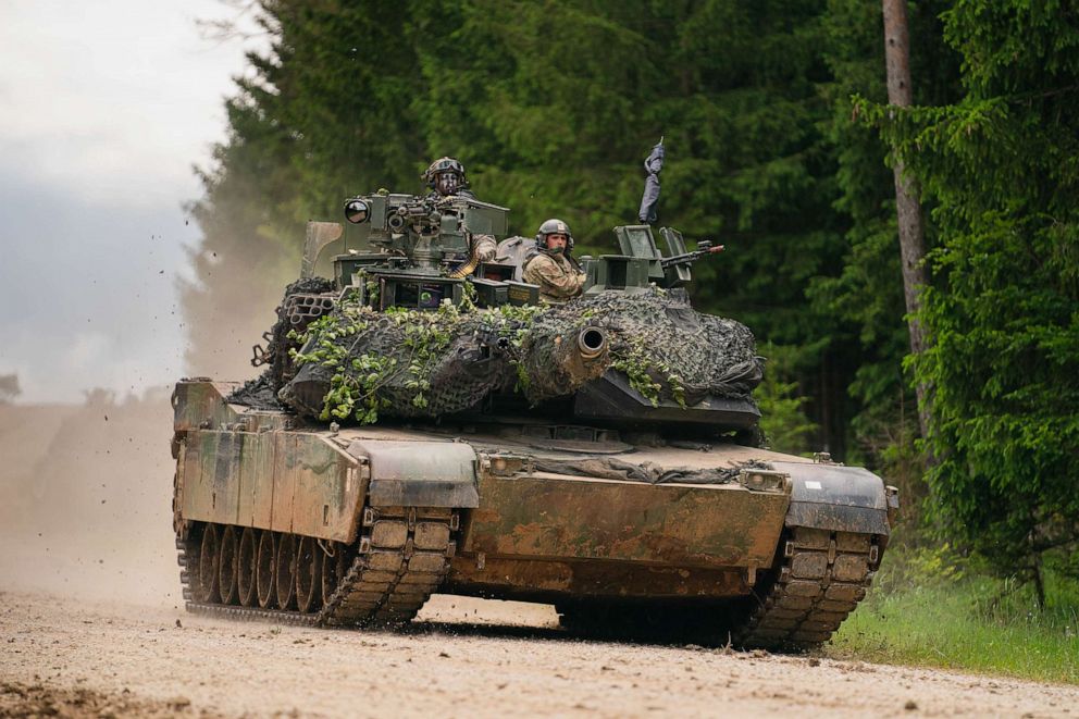 PHOTO: A US Army M1 Abrams tank drives across a road during a multinational exercise at the Hohenfels training area.