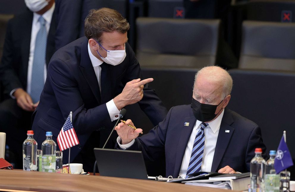 PHOTO: French President Emmanuel Macron and President Joe Biden have a conversation ahead of the NATO summit at the North Atlantic Treaty Organization (NATO) headquarters in Brussels, on June 14, 2021.