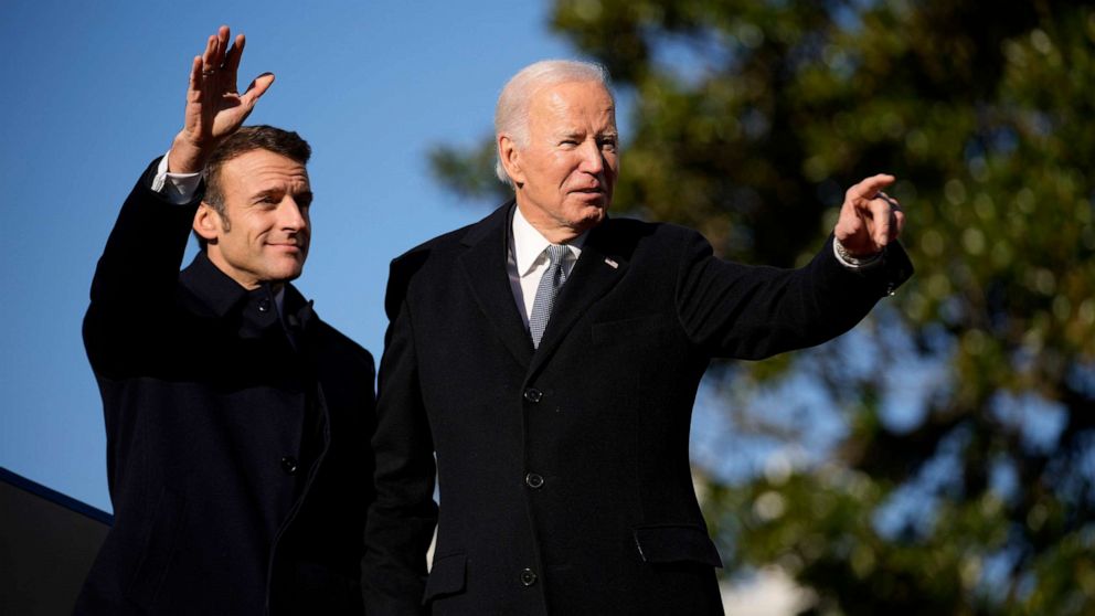 PHOTO: French President Emmanuel Macron and President Joe Biden stand on the stage during a State Arrival Ceremony on the South Lawn of the White House in Washington, Dec. 1, 2022.