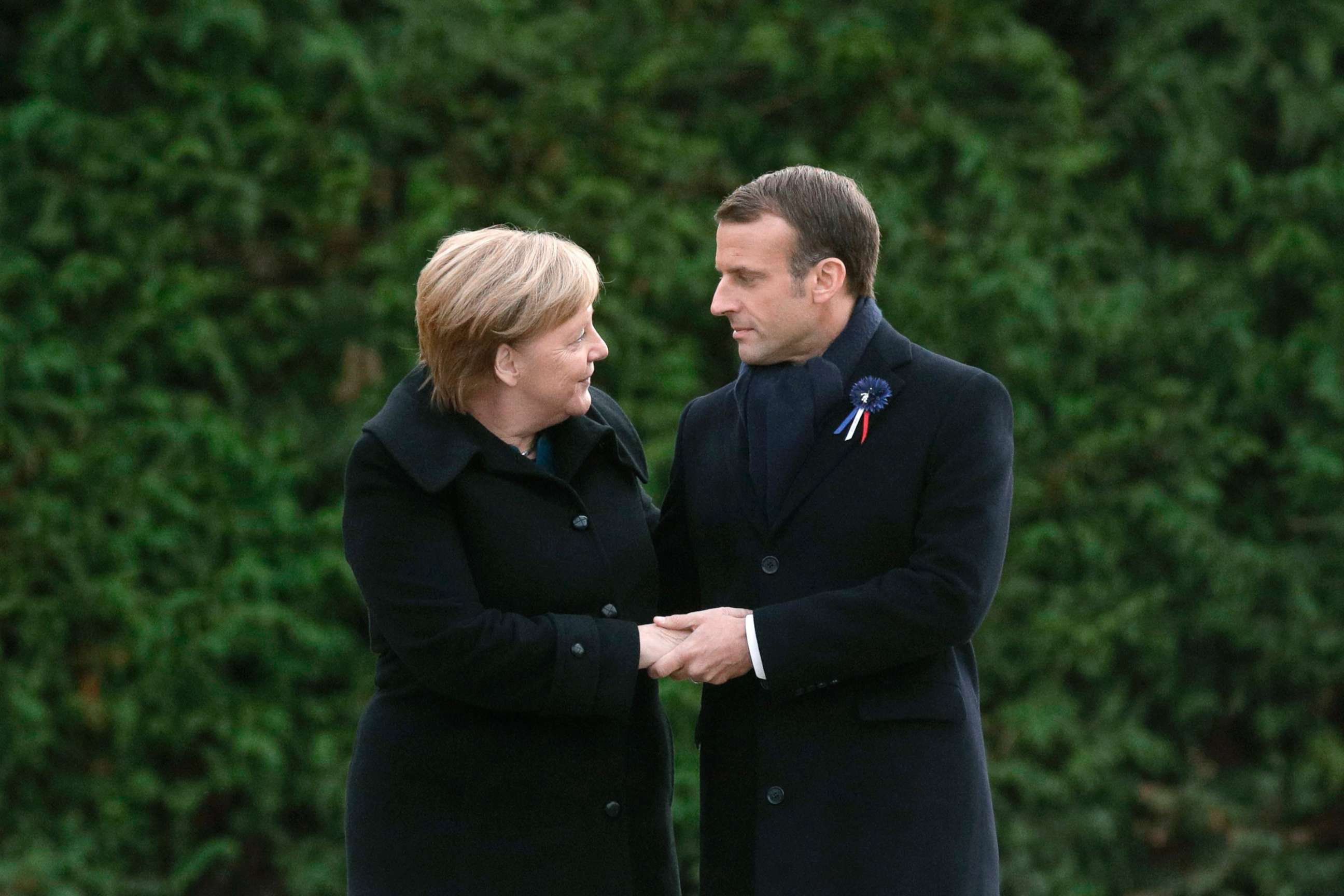 PHOTO: German Chancellor Angela Merkel and French President Emmanuel Macron hold hands after unveiling a plaque in a French-German ceremony in the clearing of Rethondes (the Glade of the Armistice) in Compiegne, northern France, Nov. 10, 2018.