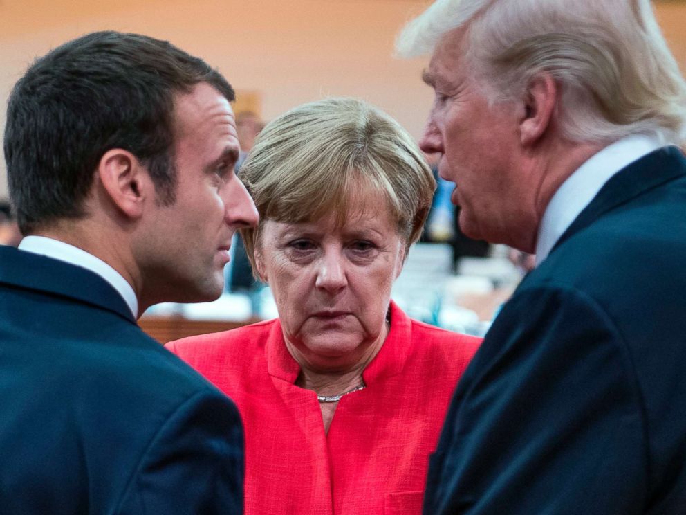 PHOTO: French President Emmanuel Macron, German Chancellor Angela Merkel and US President Donald Trump confer at the start of the first working session of the G20 meeting in Hamburg, Germany, July 7, 2017.