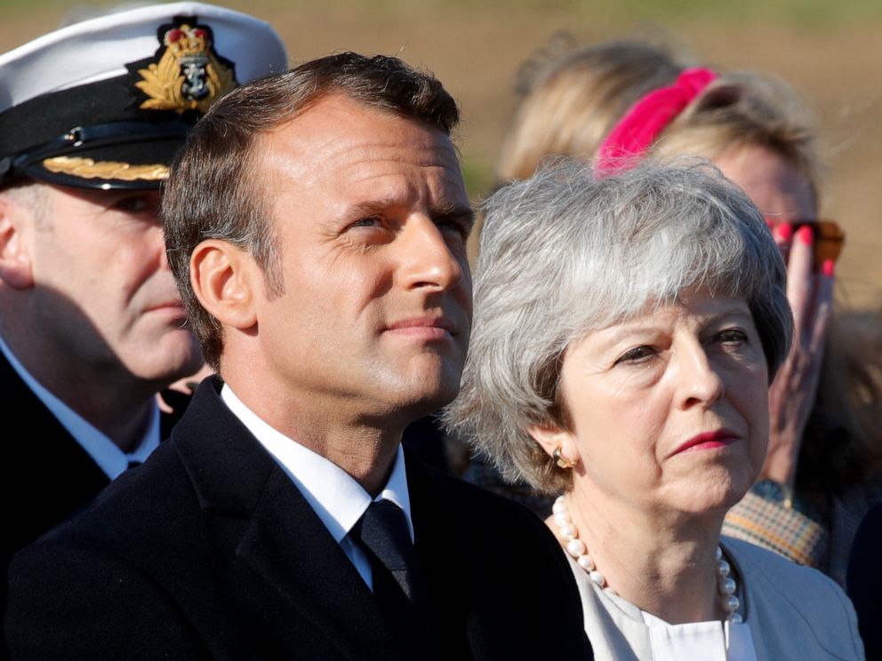 PHOTO: British Prime Minister Theresa May and French President Emmanuel Macron attend a Franco-British ceremony to mark the 75th anniversary of D-Day landings.