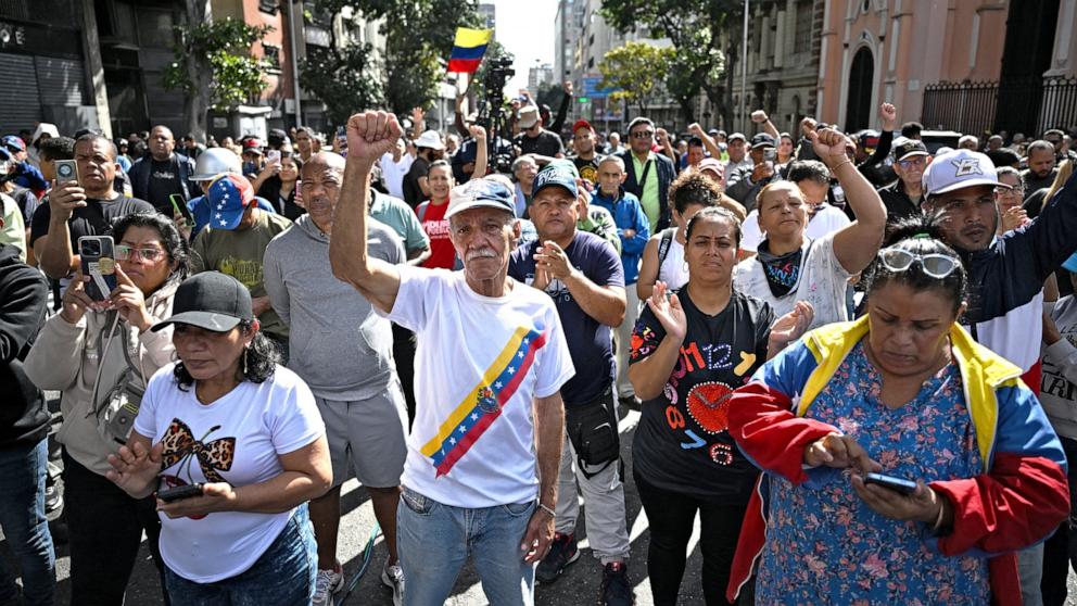 PHOTO: Supporters of Venezuela's President Nicolas Maduro gather in the streets of Caracas on Jan. 3, 2026, after US forces captured him. 