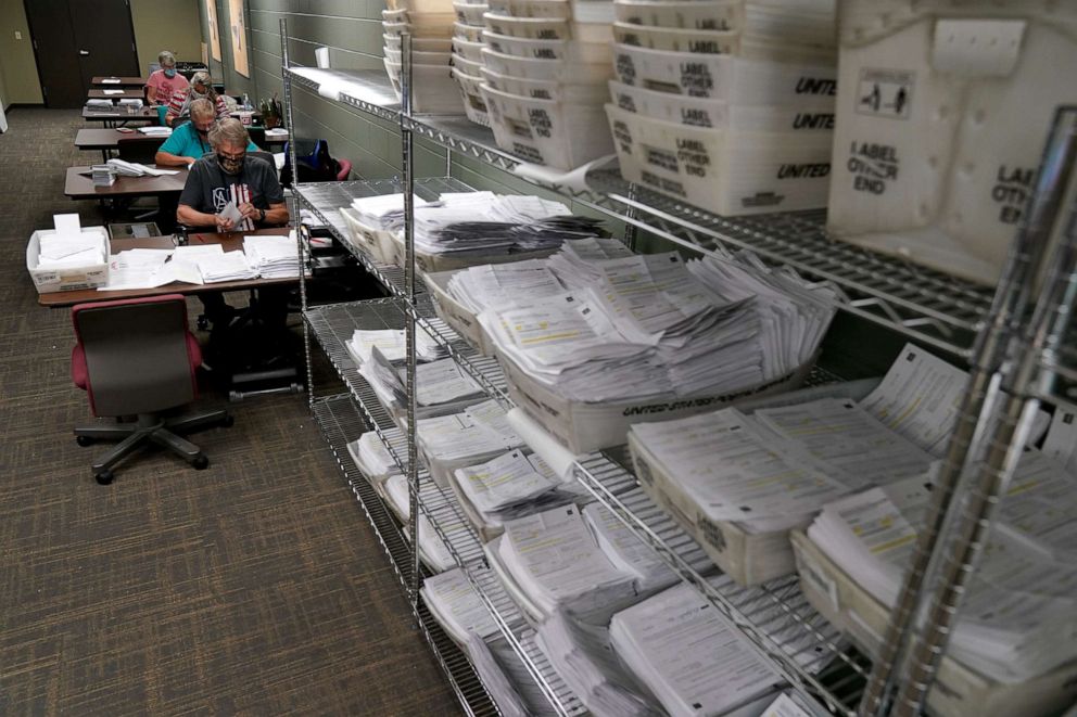 PHOTO: Election workers open and sort mail-in ballot requests at the Johnson County election office in Olathe, Kan., Sept. 22, 2020.