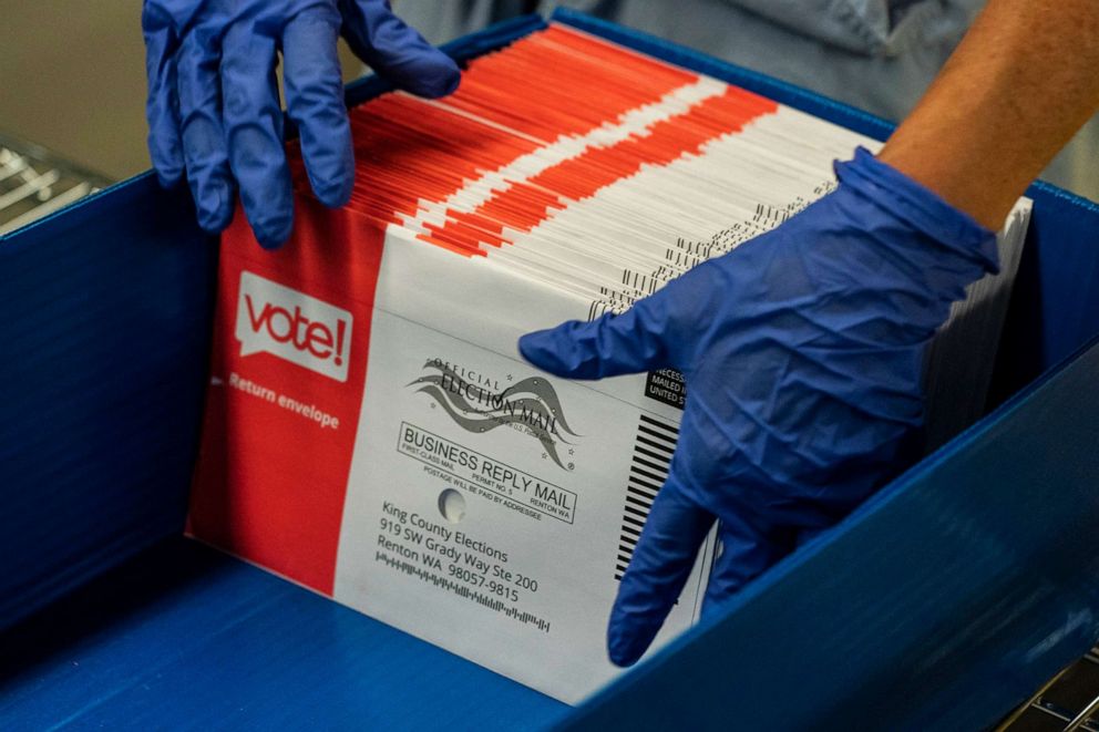 PHOTO: An elections worker sorts unopened ballots at the King County Elections headquarters on Aug. 4, 2020, in Renton, Wash.