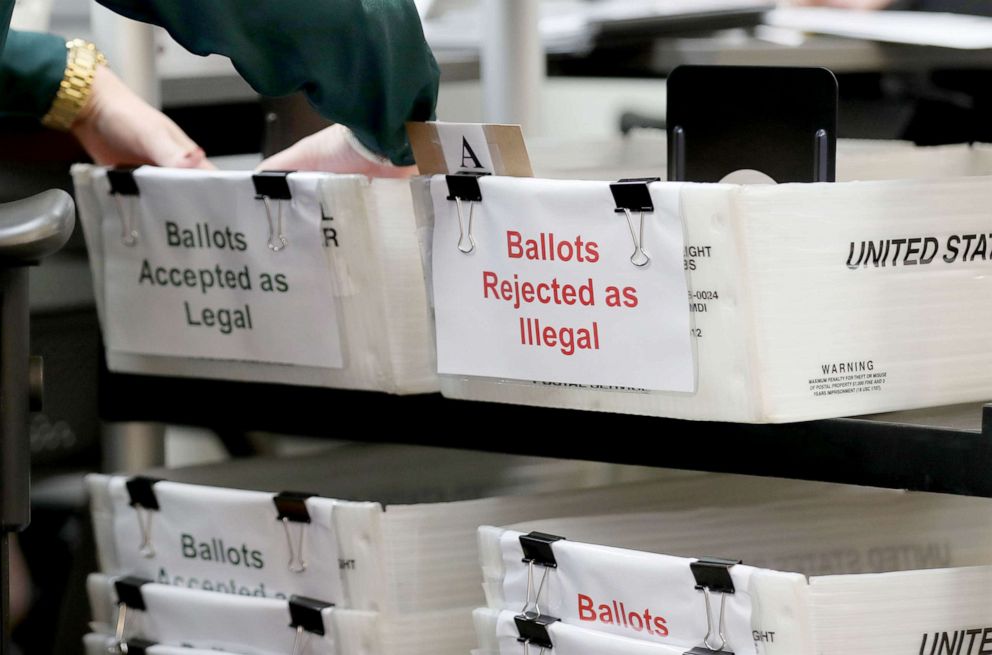 PHOTO: Boxes for Vote-by-Mail ballots that have been rejected or accepted due to signature discrepancies are set up at the Miami-Dade County Elections Department in Doral, Fla., Oct. 15, 2020.