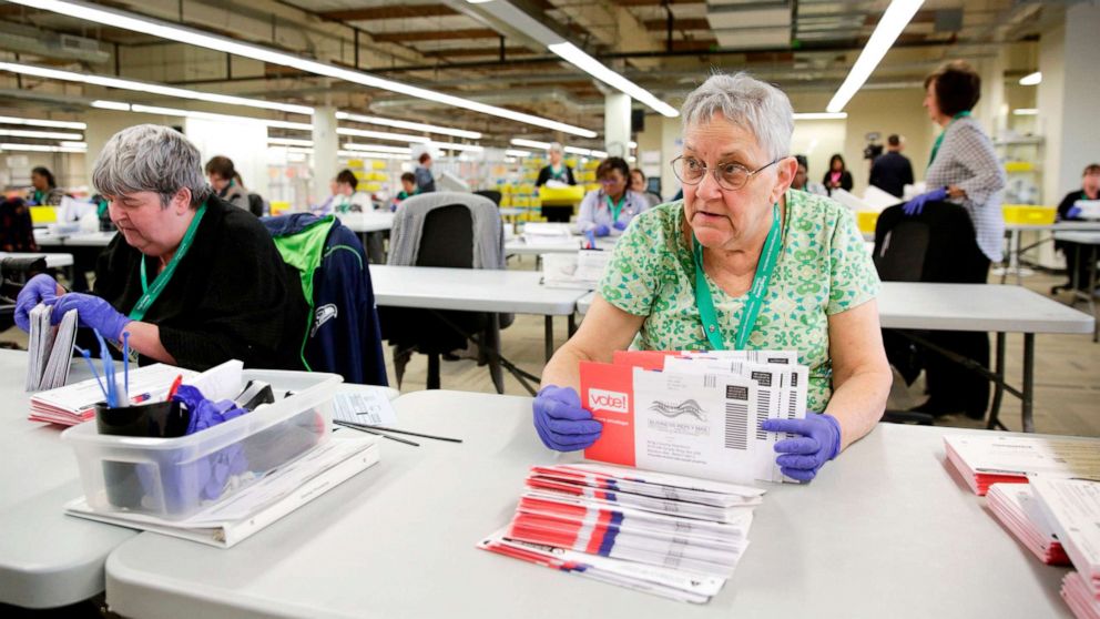 PHOTO: Election worker Ruth Ard opens vote-by-mail ballots for the presidential primary at King County Elections in Renton, Washington, March 10, 2020.