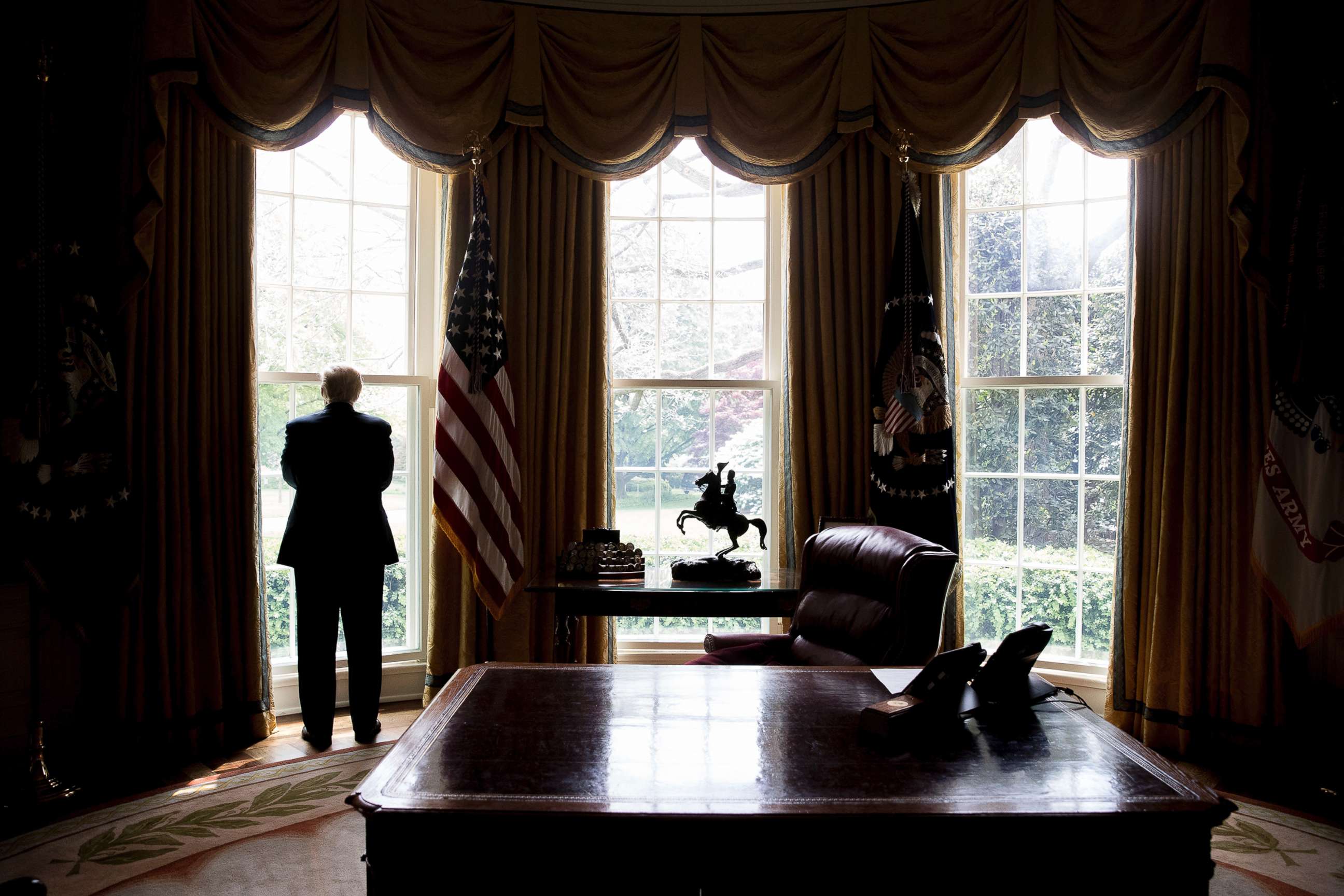 PHOTO: President Donald Trump poses for a photograph in the Oval Office, April 19, 2017. 